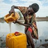 32E5162F00000578-3526234-Assia_pictured_helps_her_mother_fetch_water_from_a_lake_miles_fr-a-115_1459946952418